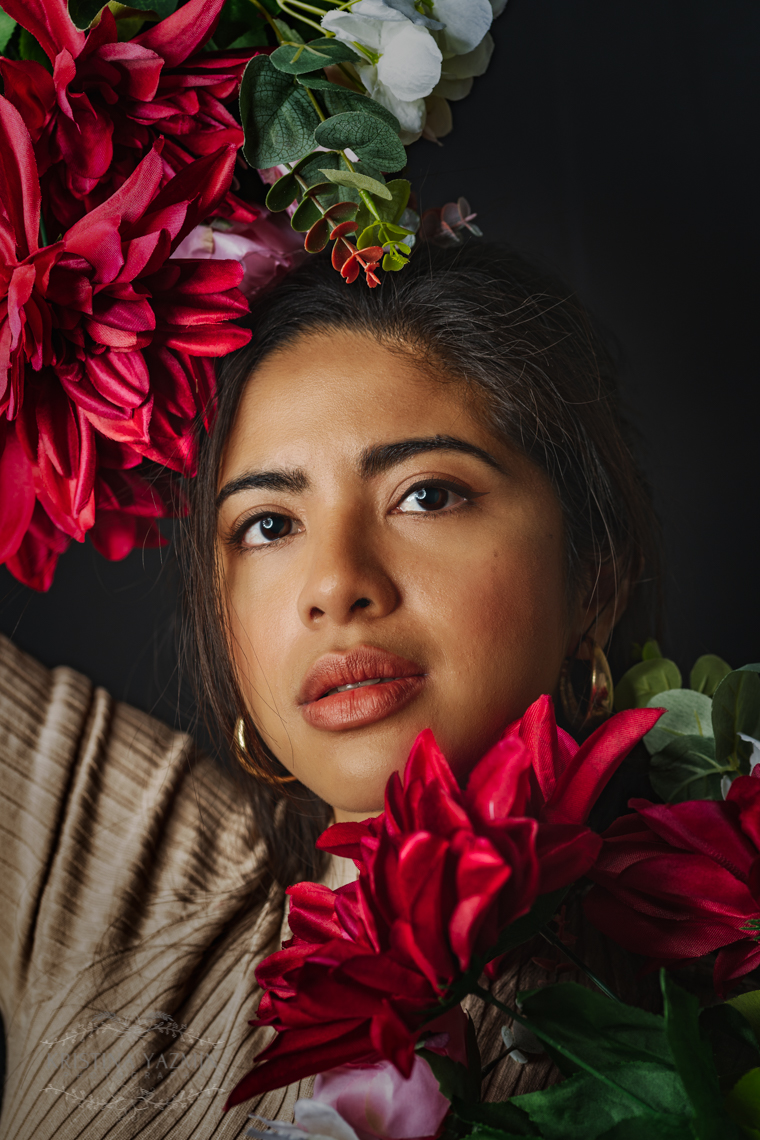 Kristina the Photographer posing for a Valentine's Day themed studio photoshoot.