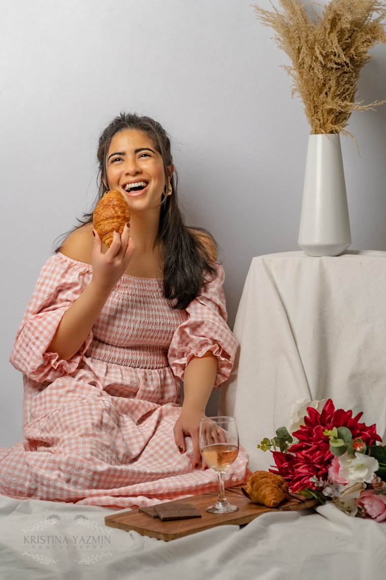 Kristina the Photographer posing for a Valentine's Day themed studio photoshoot.