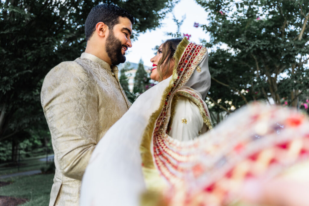 Ramsha and Anas close up, with her veil in the foreground.