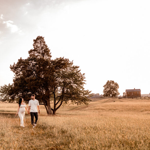 Maternity photography session at Manassas Battlefield Park during sunset.