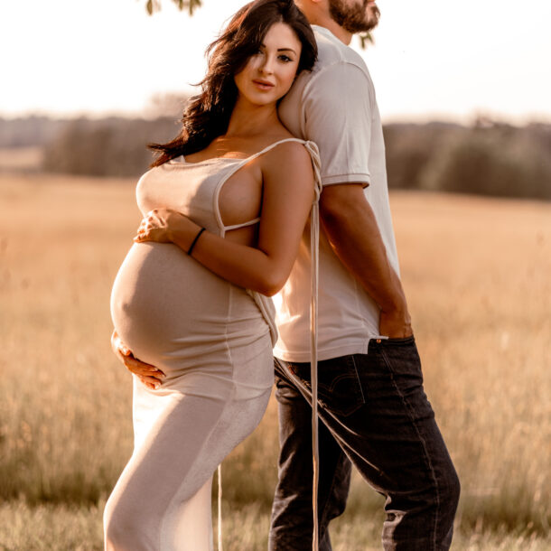 Maternity photography session at Manassas Battlefield Park during sunset.