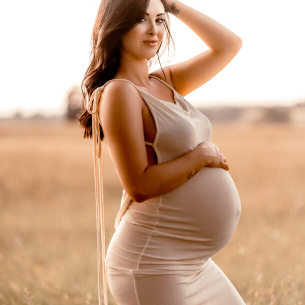 Maternity photography session at Manassas Battlefield Park during sunset.