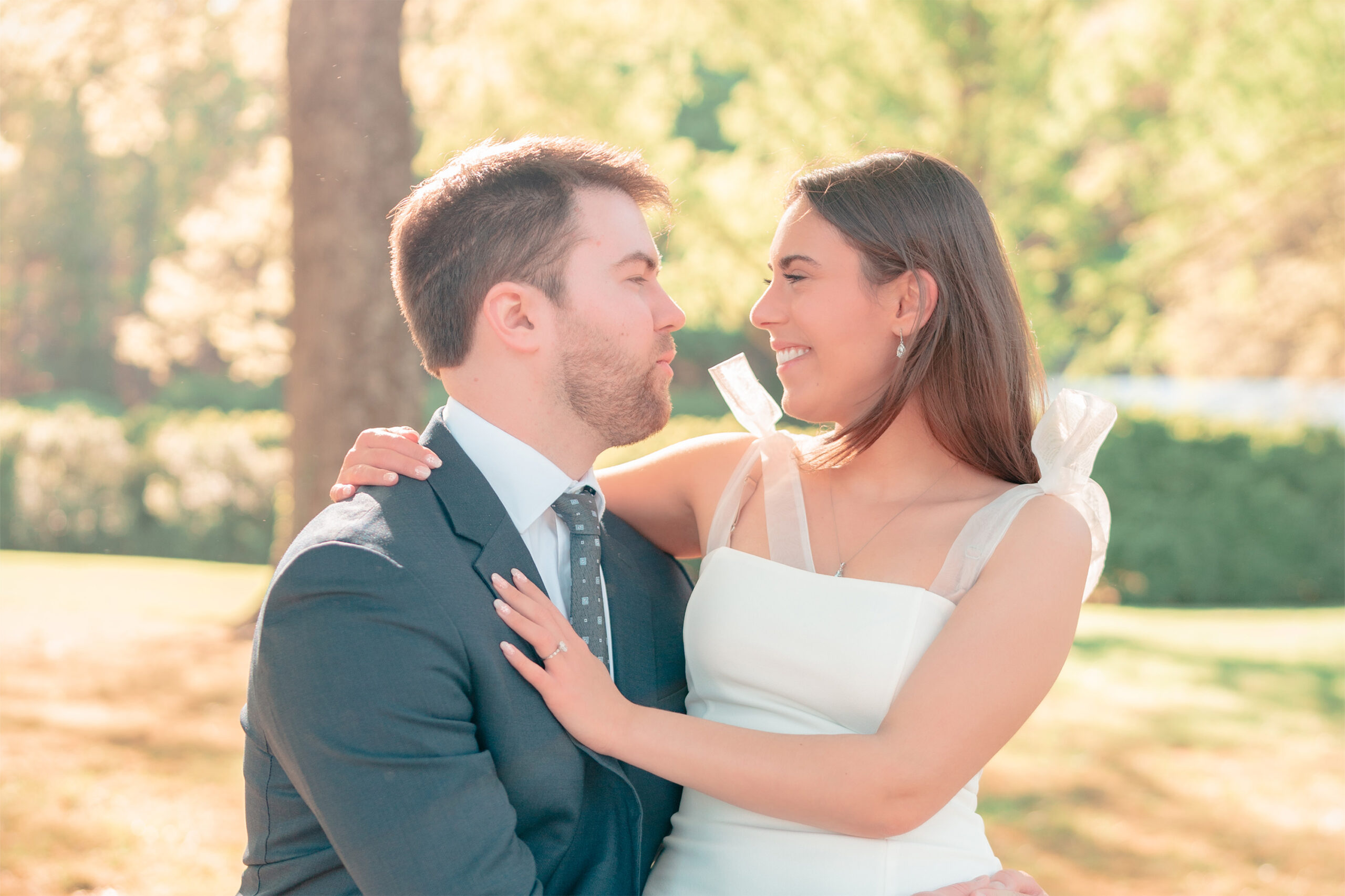 Brittany and Ryan gazing into each other’s eyes, surrounded by the natural beauty of Morven Park.